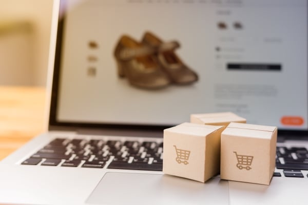 online-shopping-paper-cartons-parcel-with-shopping-cart-logo-laptop-keyboard-which-web-store-shop-screen-shopping-service-online-web-offers-home-deliveryonline-shopping-paper-cartons-parcel-with-shopping-cart-logo-laptop-keyboard-which-web-store-shop-screen-shopping-service-online-web-offers-home-delivery