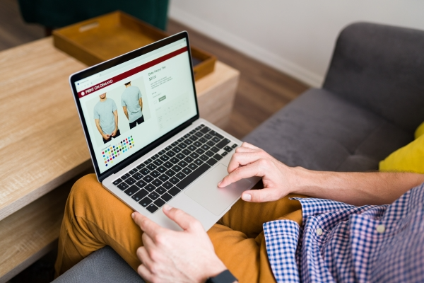 adult-man-doing-online-shopping-during-leisure-day-home-young-man-buying-clothes-online
