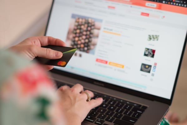 woman-shopping-online-with-credit-card-2023-11-27-05-36-50-utc