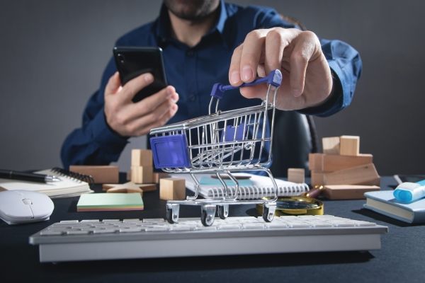 Man using phone showing mini cart